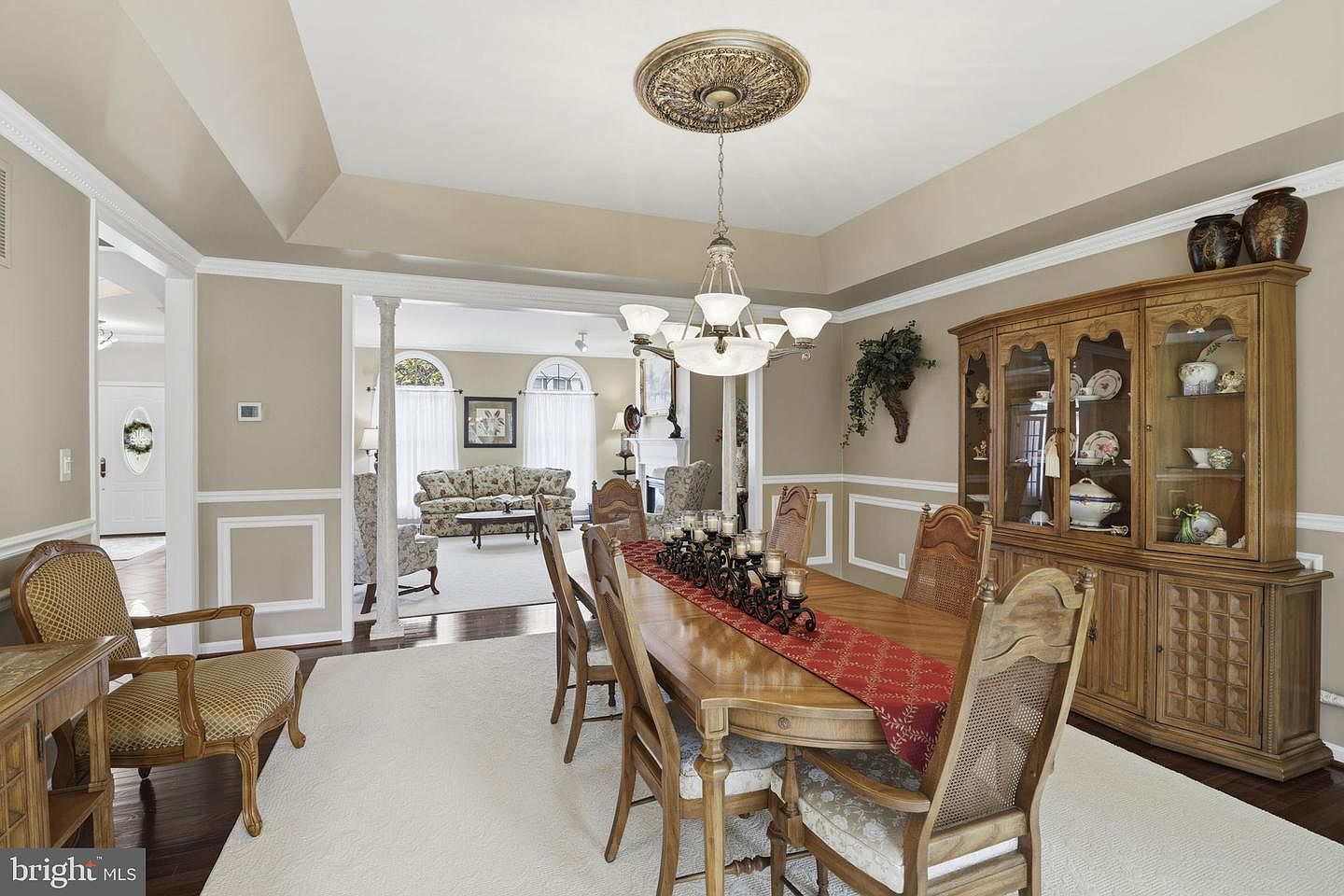 Dining room with chair rail, wainscoting and chandelier