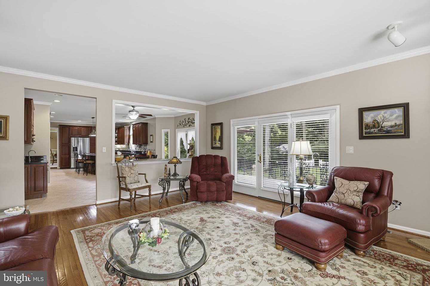 Family room open to the kitchen with recessed lighting
