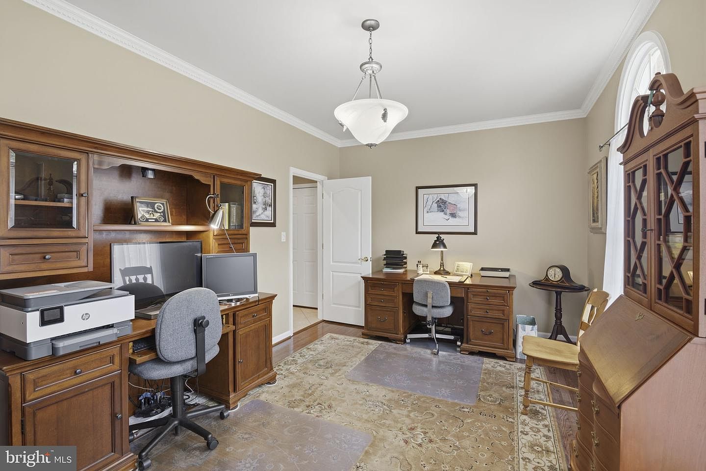 Main-level home office with built-in desk and cabinetry
