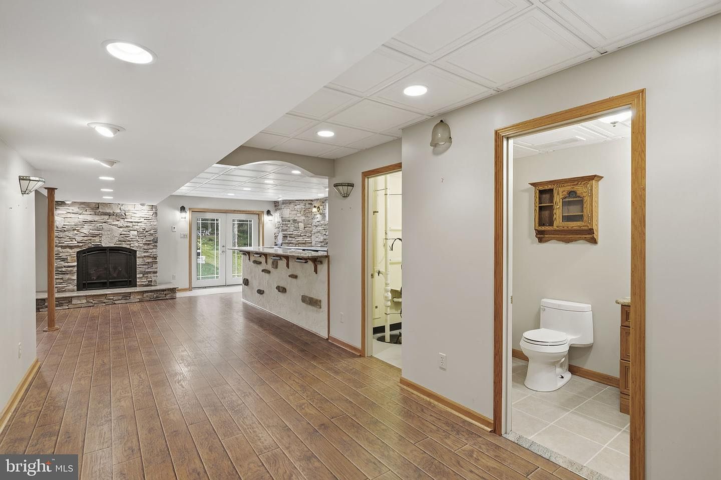 Finished lower level with hardwood floors and half bath